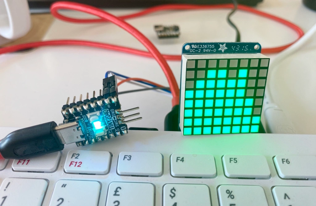 'A matrix display client and the CPU activity display example running on a Raspberry Pi 400'