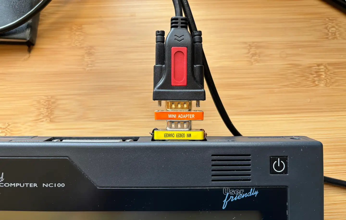 The serial adaptor in place on the NC100. Image copyright 2025 tony smith. All rights reserved